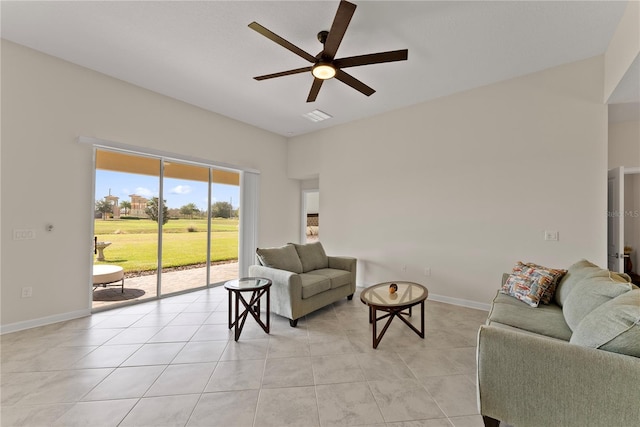 tiled living room featuring ceiling fan