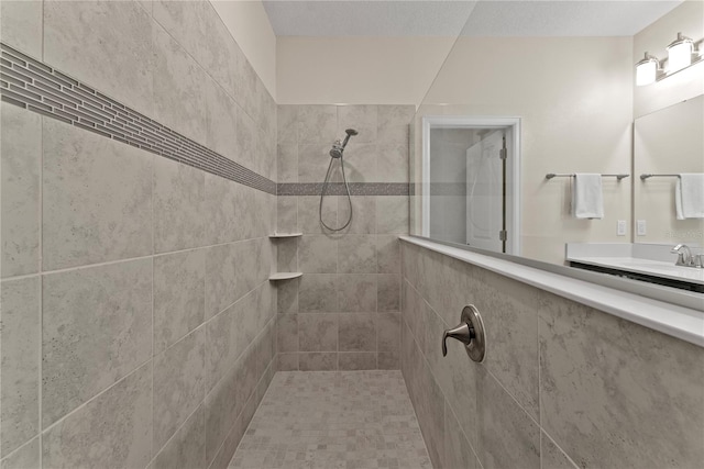 bathroom with tiled shower