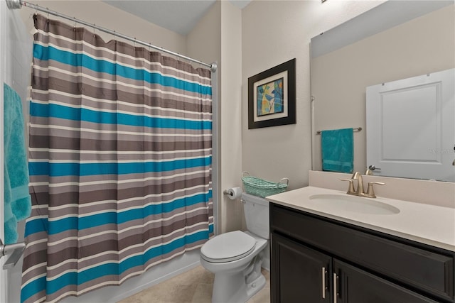 full bathroom with tile patterned floors, vanity, shower / bath combo, and toilet