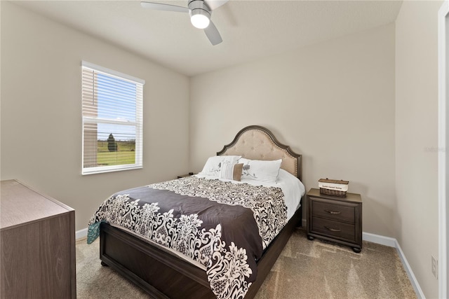 bedroom featuring light colored carpet and ceiling fan