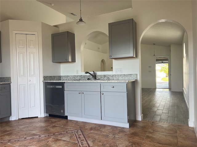 kitchen featuring gray cabinets, dishwasher, decorative light fixtures, and sink