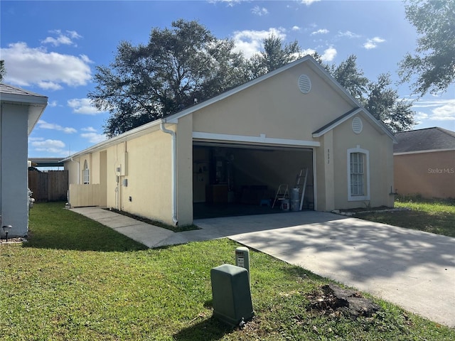 exterior space with a garage and a lawn