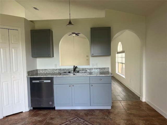 kitchen featuring dishwasher, lofted ceiling, sink, hanging light fixtures, and ceiling fan