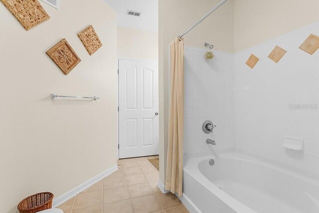 12843 Madison Pointe Cir Unit 107, Orlando, FL 32821 - full bath featuring tile patterned flooring and shower / bath combo