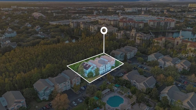 12843 Madison Pointe Cir Unit 107, Orlando, FL 32821 - aerial view of property and surrounding area featuring property parcel outlined and a nearby body of water