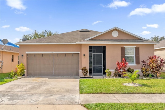 ranch-style house with a garage and a front yard