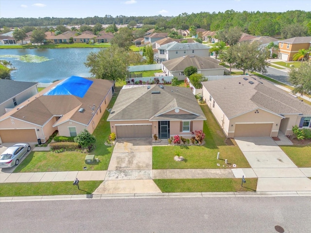 birds eye view of property featuring a water view