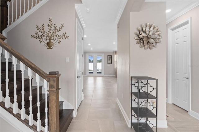 hallway featuring light tile patterned floors, ornamental molding, and french doors