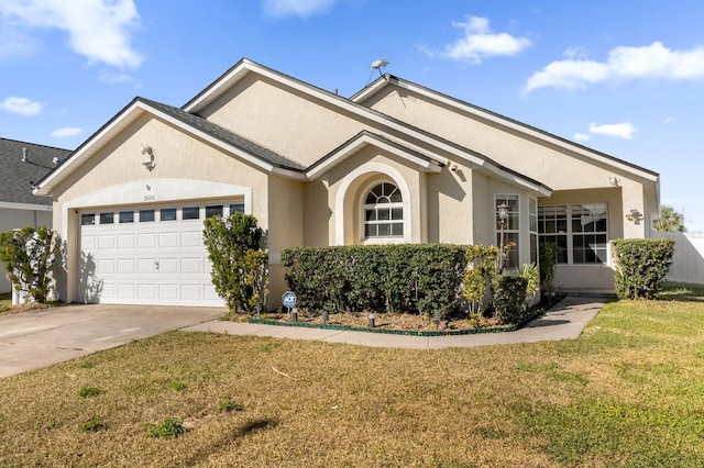 ranch-style house featuring a garage and a front lawn