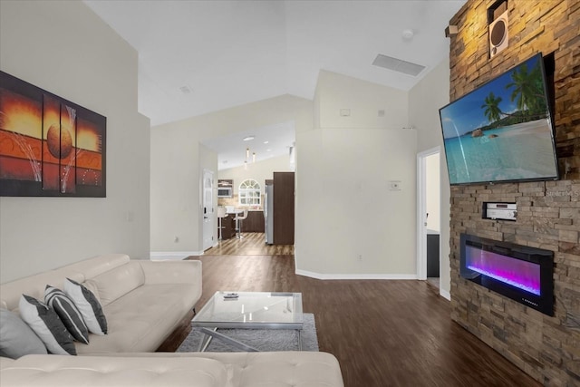 living room with a fireplace, high vaulted ceiling, and wood-type flooring