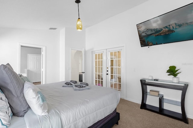 carpeted bedroom featuring french doors, access to outside, and vaulted ceiling