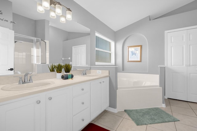 bathroom featuring vanity, separate shower and tub, tile patterned floors, and lofted ceiling