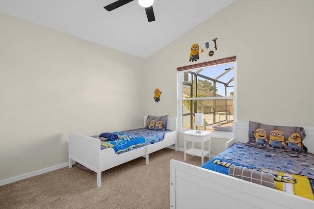 carpeted bedroom with ceiling fan and lofted ceiling