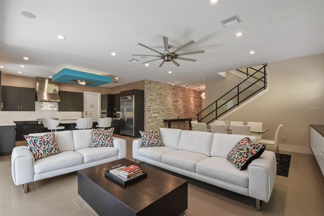 tiled living room featuring ceiling fan