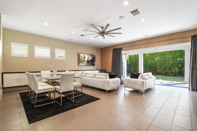 living room with ceiling fan and light tile patterned flooring