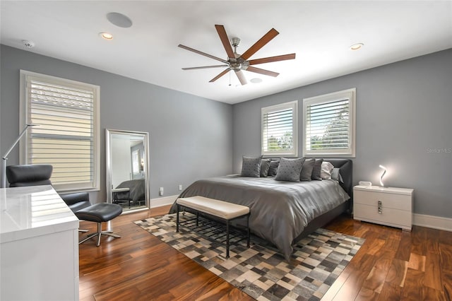 bedroom featuring ceiling fan and dark wood-type flooring