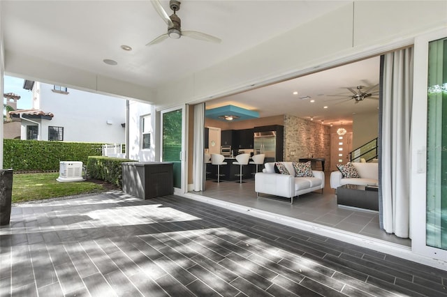 view of patio featuring ceiling fan