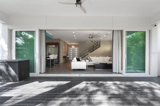 view of patio with outdoor lounge area, ceiling fan, and a wooden deck