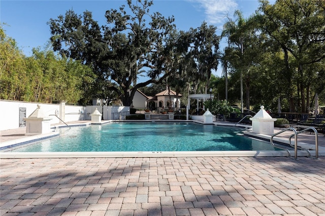 view of swimming pool featuring a patio area