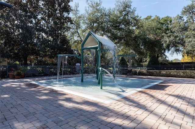 view of pool with a playground