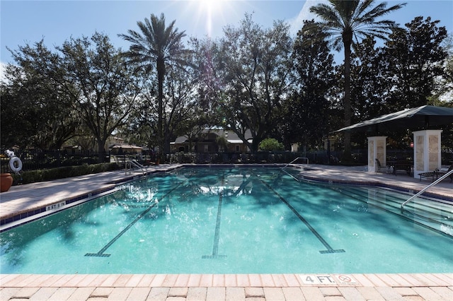 view of swimming pool with a patio area