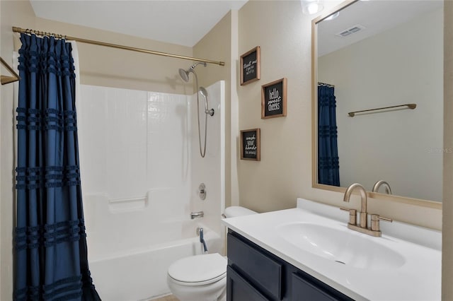 full bathroom featuring shower / bathtub combination with curtain, vanity, and toilet