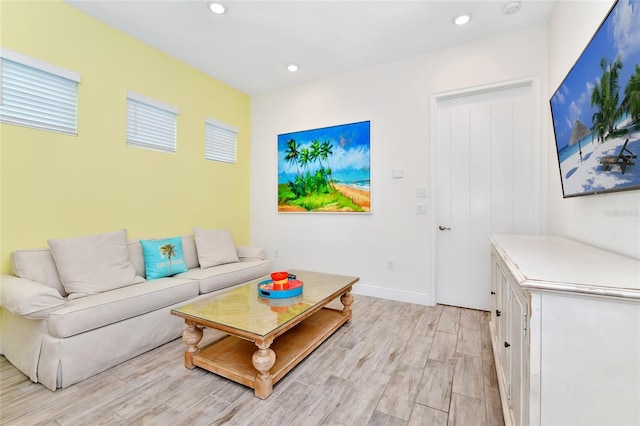 living room with light hardwood / wood-style flooring