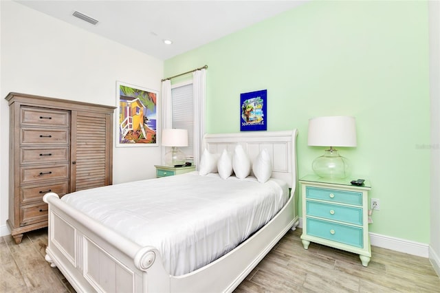 bedroom with light wood-type flooring