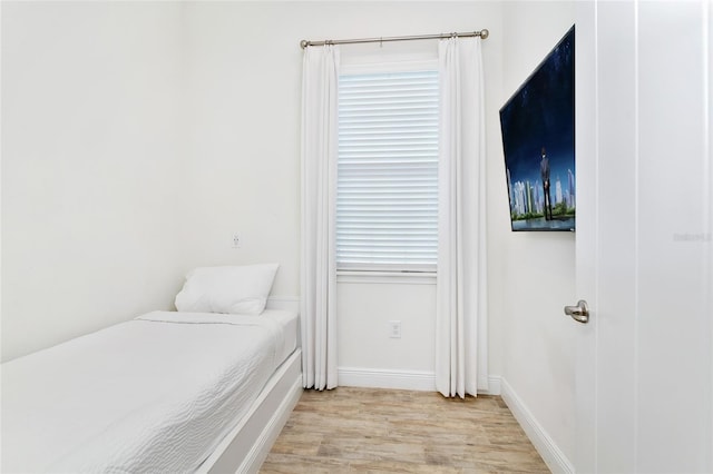 bedroom with light hardwood / wood-style flooring