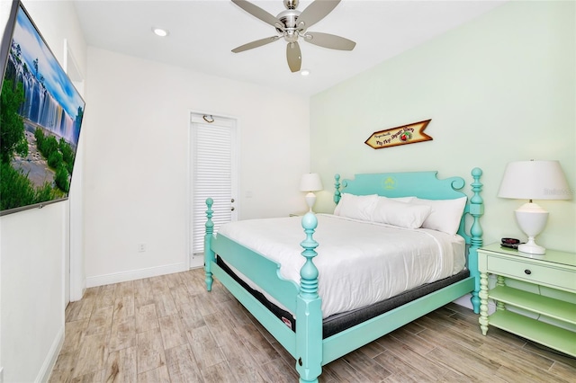 bedroom with light wood-type flooring and ceiling fan