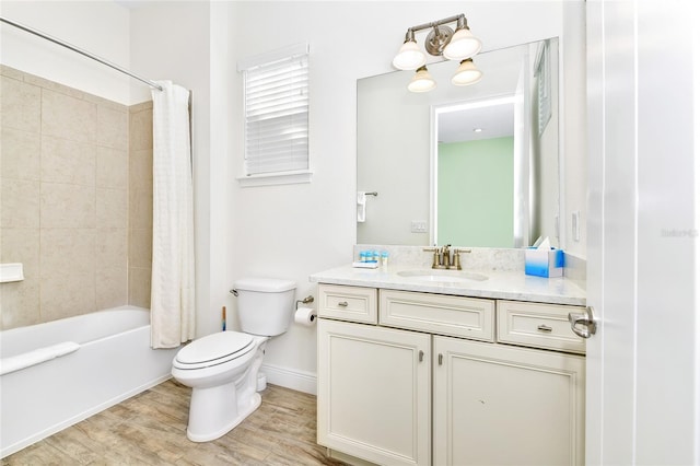 full bathroom featuring shower / bath combo with shower curtain, toilet, wood-type flooring, and vanity