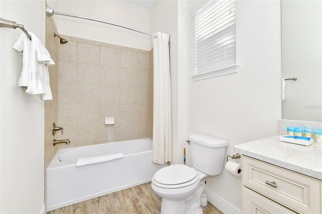 full bathroom with vanity, toilet, shower / bathtub combination with curtain, and hardwood / wood-style flooring