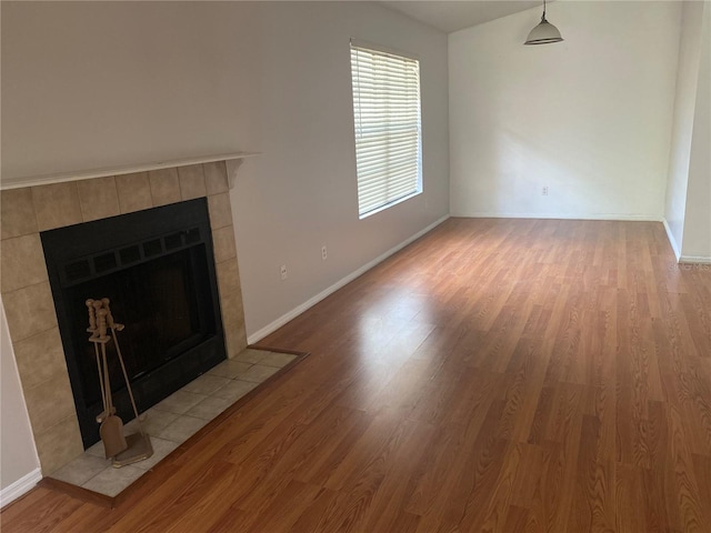 unfurnished living room with light hardwood / wood-style floors and a fireplace