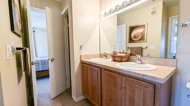 bathroom with tile patterned floors and vanity