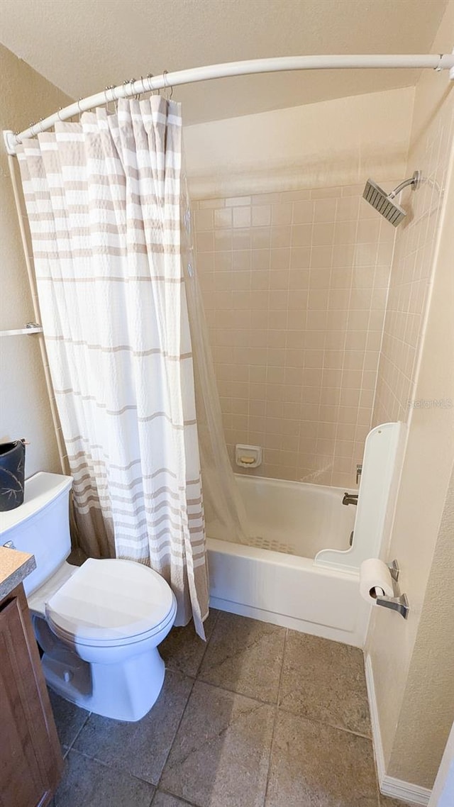 full bathroom with vanity, shower / bath combo, and toilet