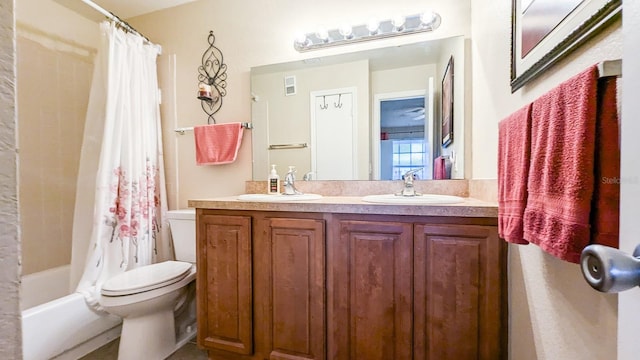 full bathroom featuring vanity, toilet, and shower / bath combo with shower curtain