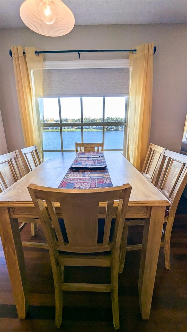 dining space with a water view