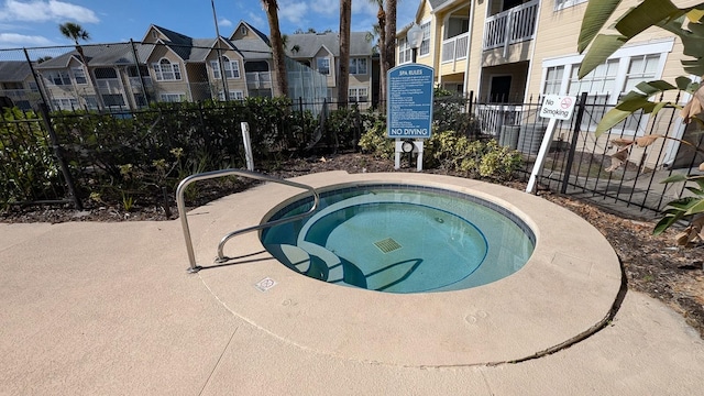 view of pool featuring a hot tub