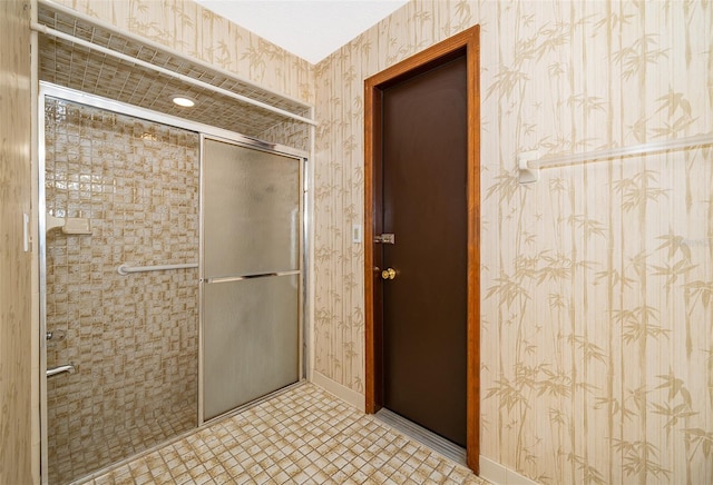 bathroom featuring tile patterned floors and a shower with shower door