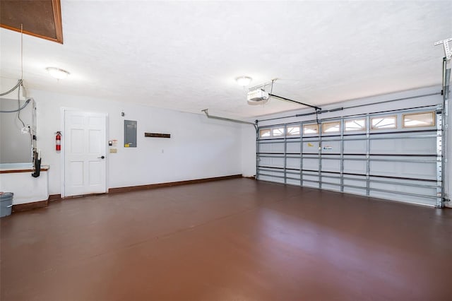 garage with electric panel and a garage door opener