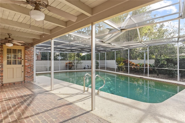 view of pool featuring a lanai, a patio area, and ceiling fan