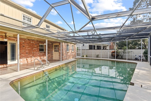 view of pool with a lanai and a patio