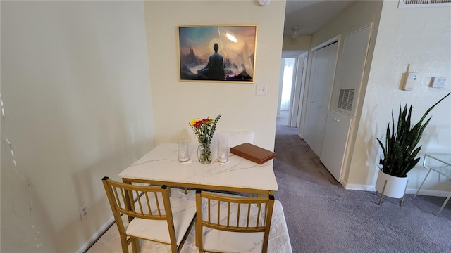 view of carpeted dining space