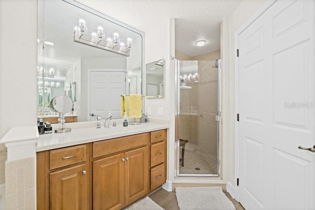 134 Starboard Ln Unit 705, Merritt Island, FL 32953 - bathroom featuring vanity, a shower stall, and a textured ceiling