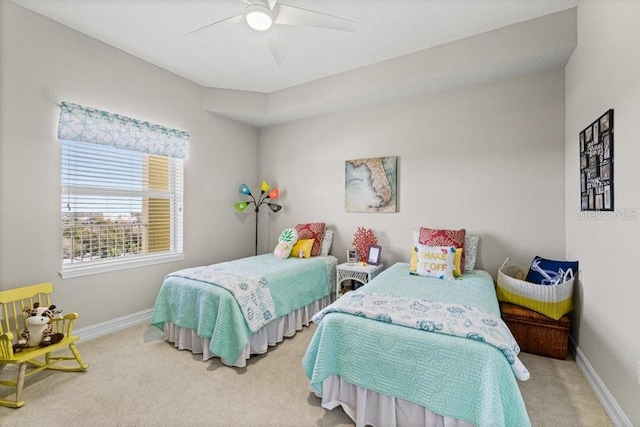 134 Starboard Ln Unit 705, Merritt Island, FL 32953 - bedroom with carpet flooring, baseboards, and a ceiling fan