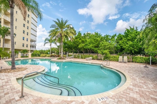 view of swimming pool featuring a patio