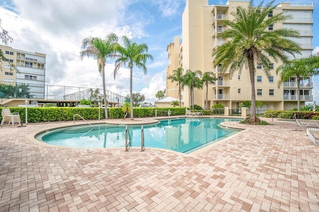 view of swimming pool with a patio area