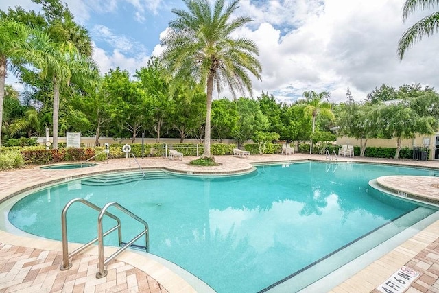 view of swimming pool featuring a patio area