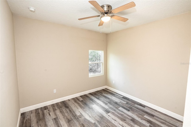 empty room featuring hardwood / wood-style floors, ceiling fan, and a textured ceiling