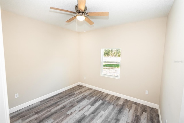 empty room featuring hardwood / wood-style flooring, ceiling fan, and a textured ceiling